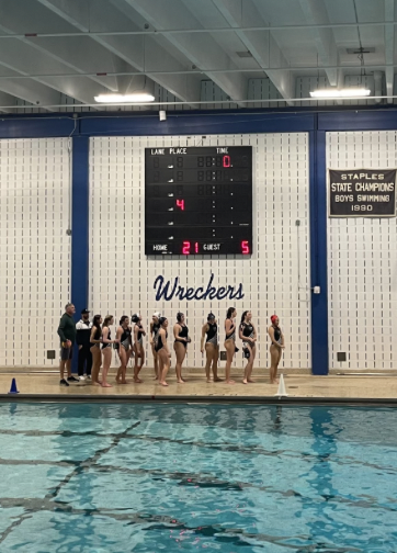 The Staples’ girls water polo team lines up before an impressive victory against Choate. 